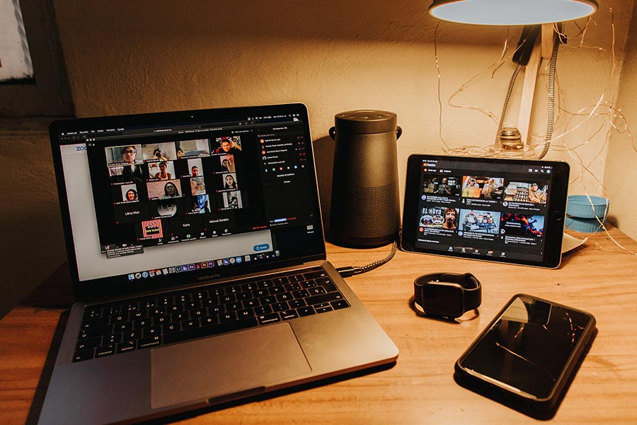 person's laptop open to live Zoom call